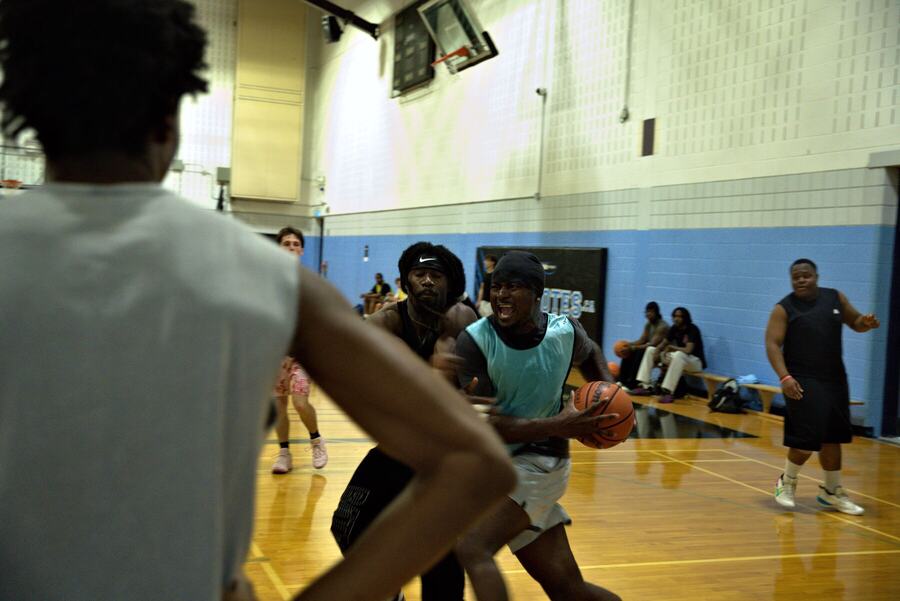 A player attacking the basket, fully locked in