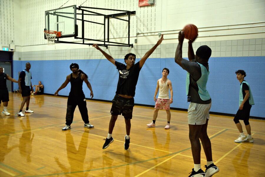 A jump shot over an outstretched defender