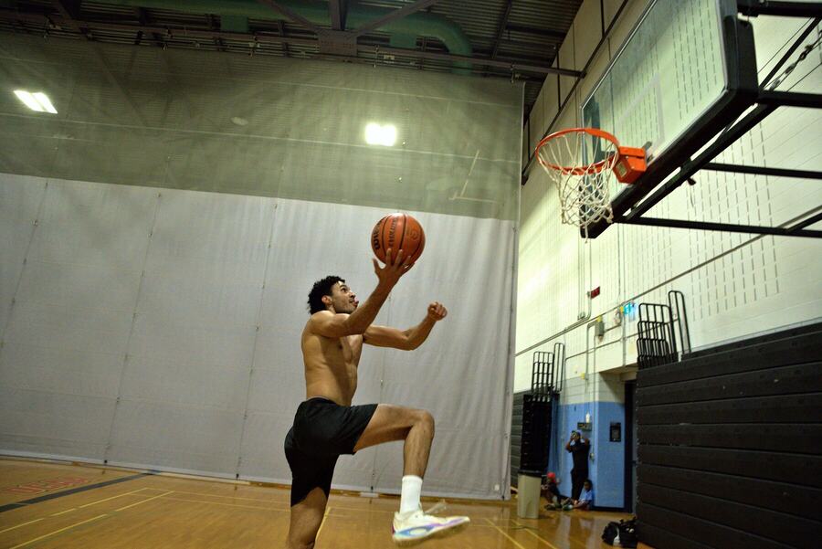 A player rising for a layup